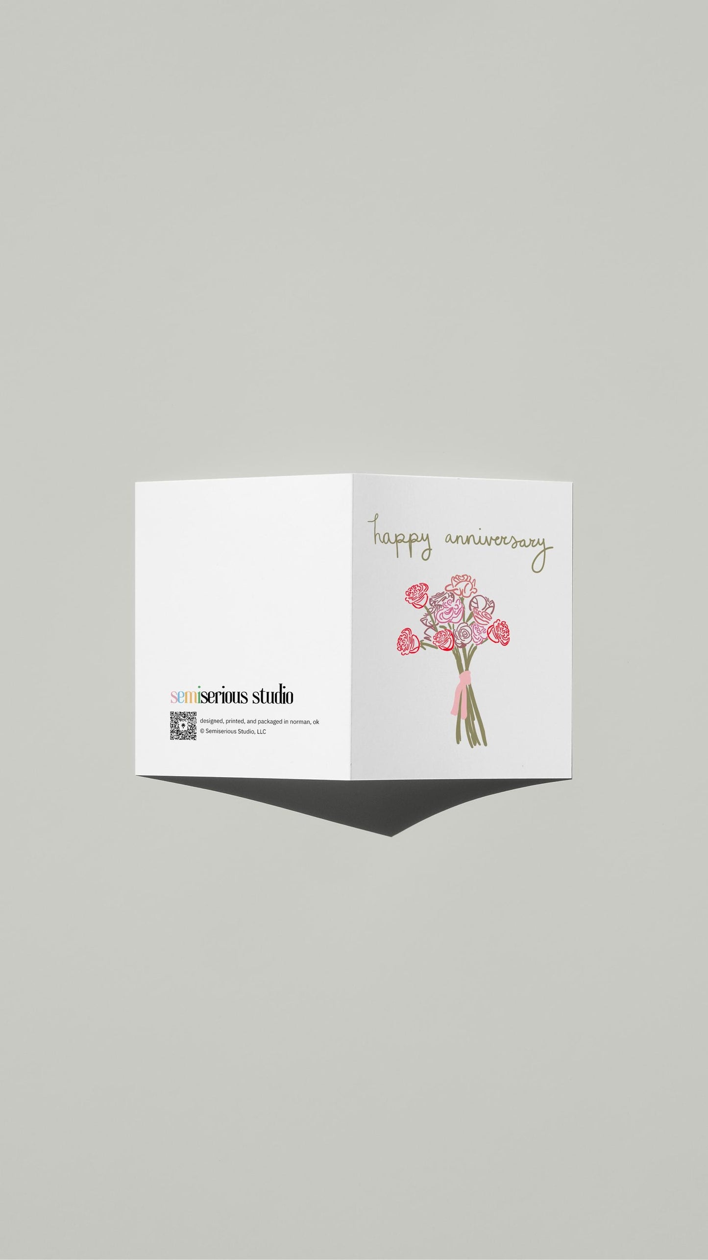 Bouquet of Roses Anniversary card standing open, showing the front artwork and the Semiserious Studio logo on the back
