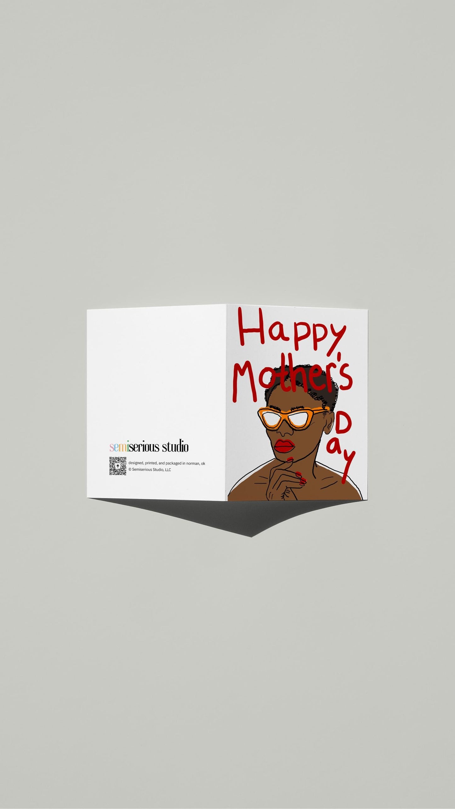 Cool Mom in Sunglasses Mother's Day card standing open, showing the front artwork and the Semiserious Studio logo on the back