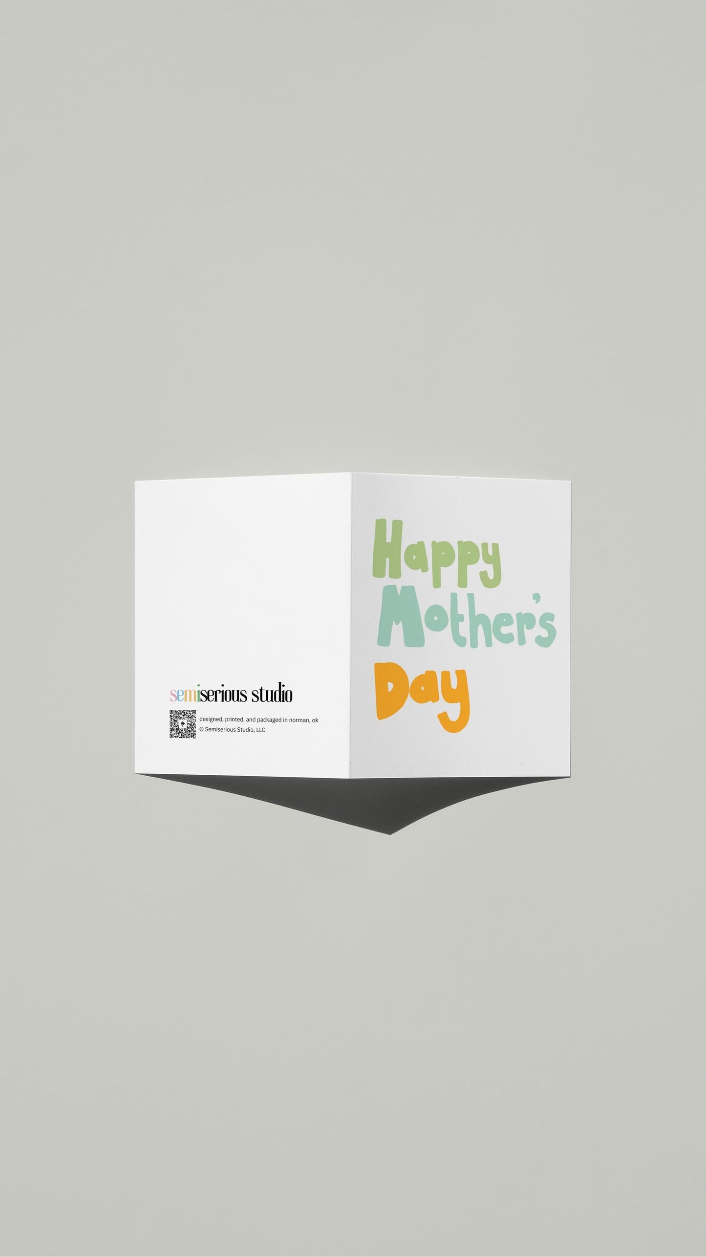 Simple Colorful Mother's Day card standing open, showing the front artwork and the Semiserious Studio logo on the back