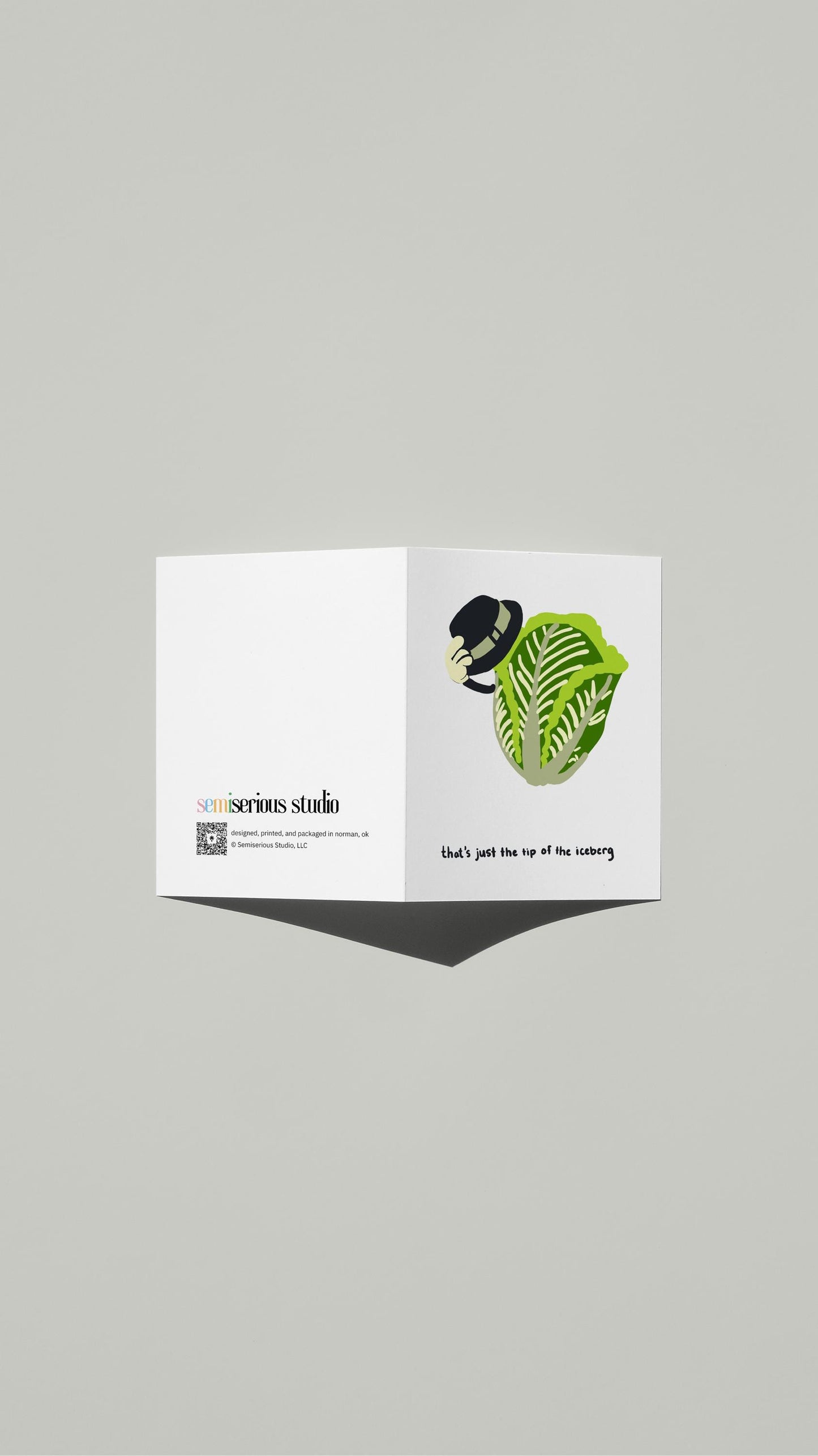 Tip of the Iceberg Pun card standing open, showing the front artwork and the Semiserious Studio logo on the back