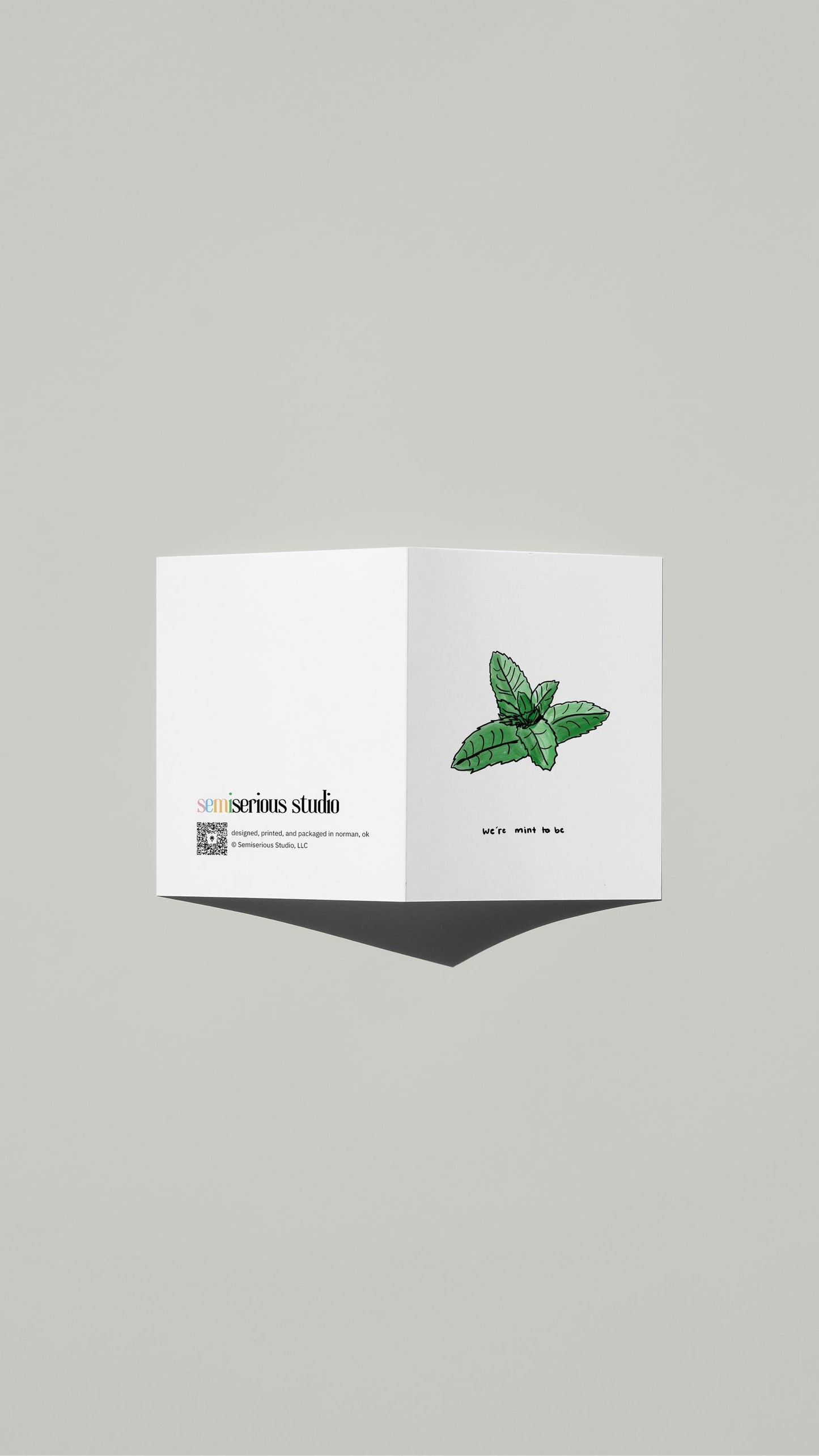 We're Mint To Be Valentine card standing open, showing the front artwork and the Semiserious Studio logo on the back