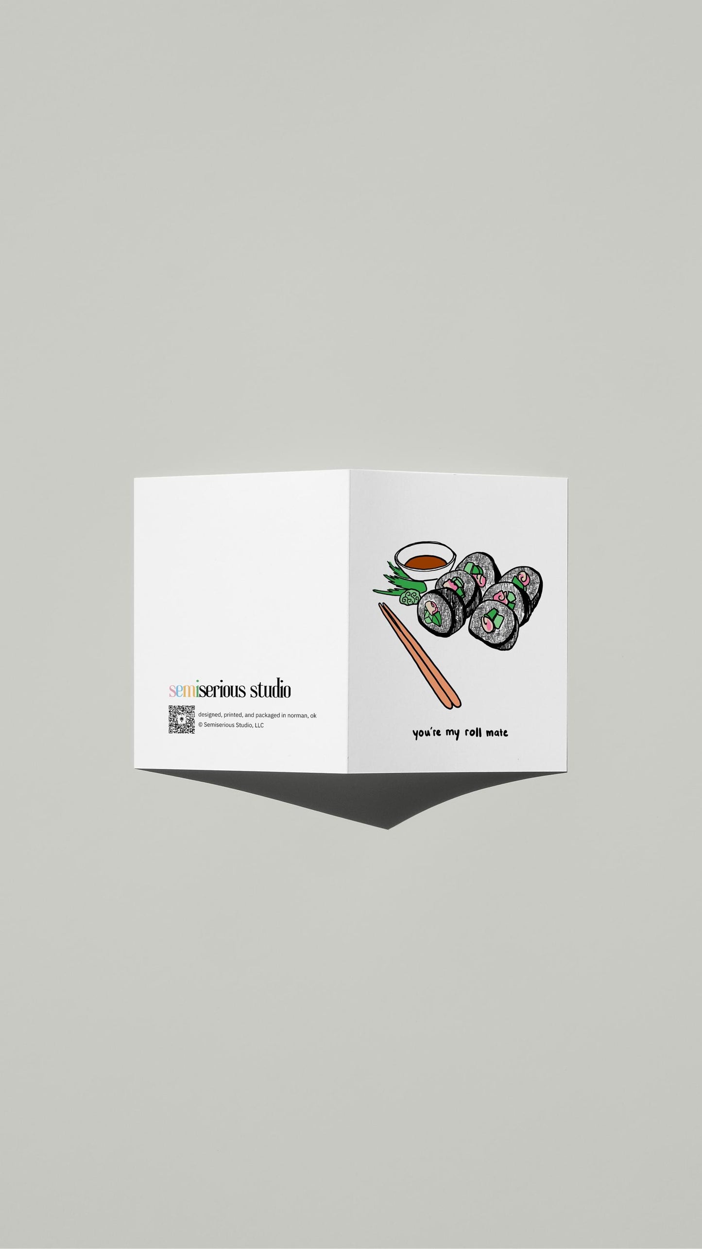 You're My Roll Mate Valentine card standing open, showing the front artwork and the Semiserious Studio logo on the back
