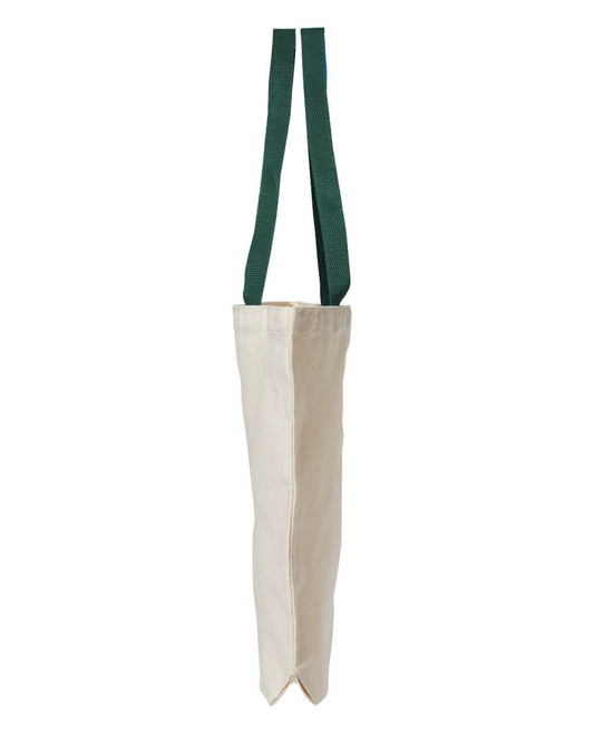 Side view of the natural canvas tote bag with green handles, showing the 3 inch gusset