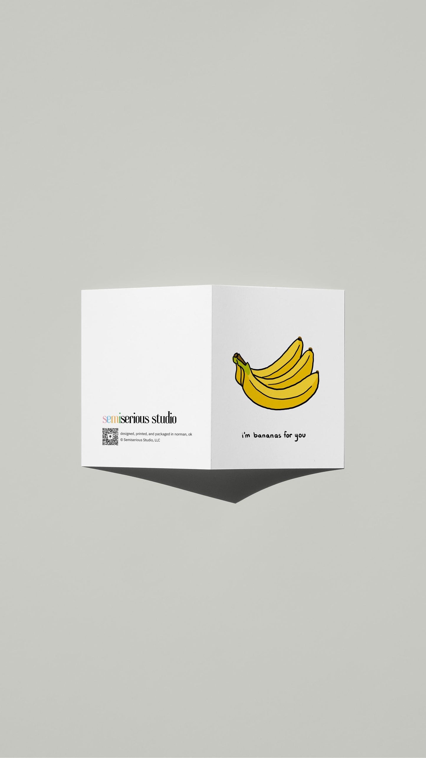 Bananas for You Valentine card standing open, showing the front artwork and the Semiserious Studio logo on the back