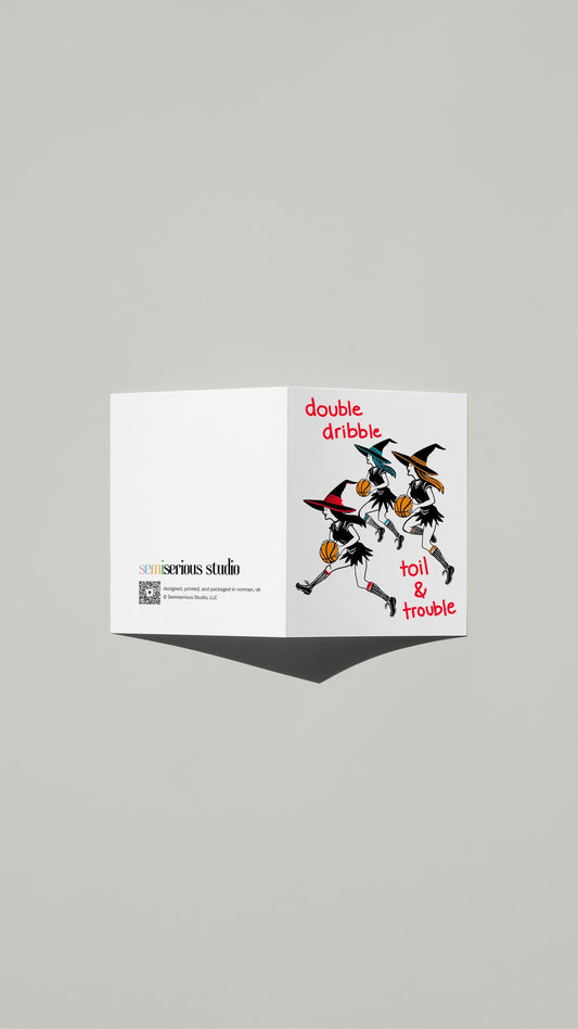 Basketball Witches card standing open, showing the front artwork and the Semiserious Studio logo on the back