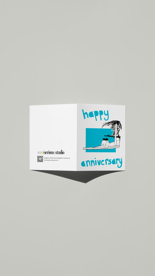 Beach Vacation Anniversary card standing open, showing the front artwork and the Semiserious Studio logo on the back