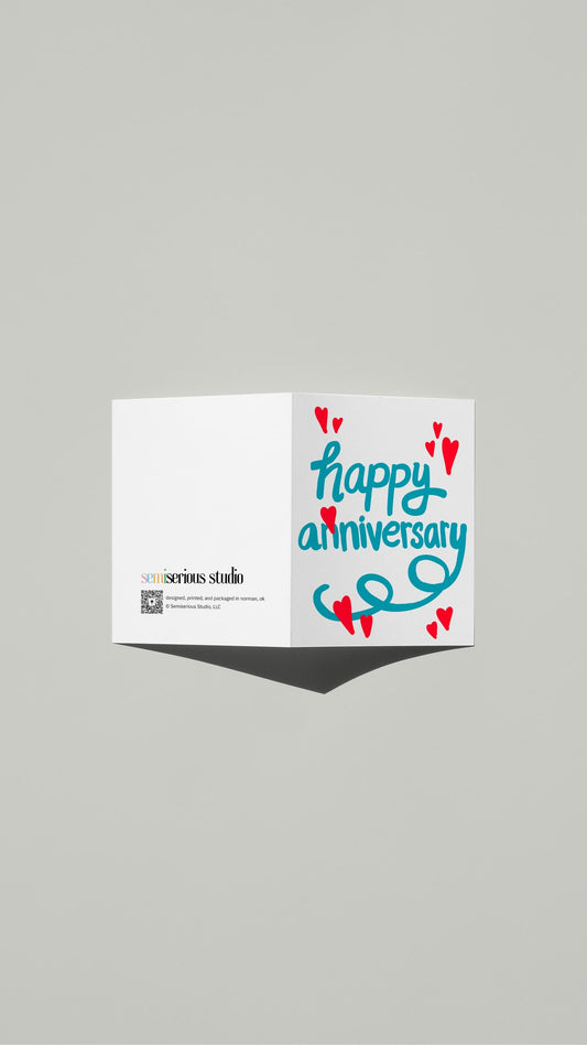 Blue Font Red Hearts Anniversary card standing open, showing the front artwork and the Semiserious Studio logo on the back