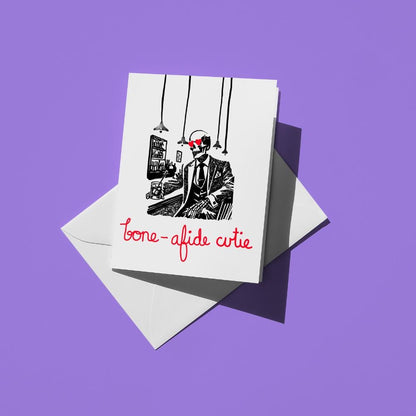Hand-drawn illustration of a skeleton wearing a suit and sitting at the bar with hearts in his eyes and a message that says