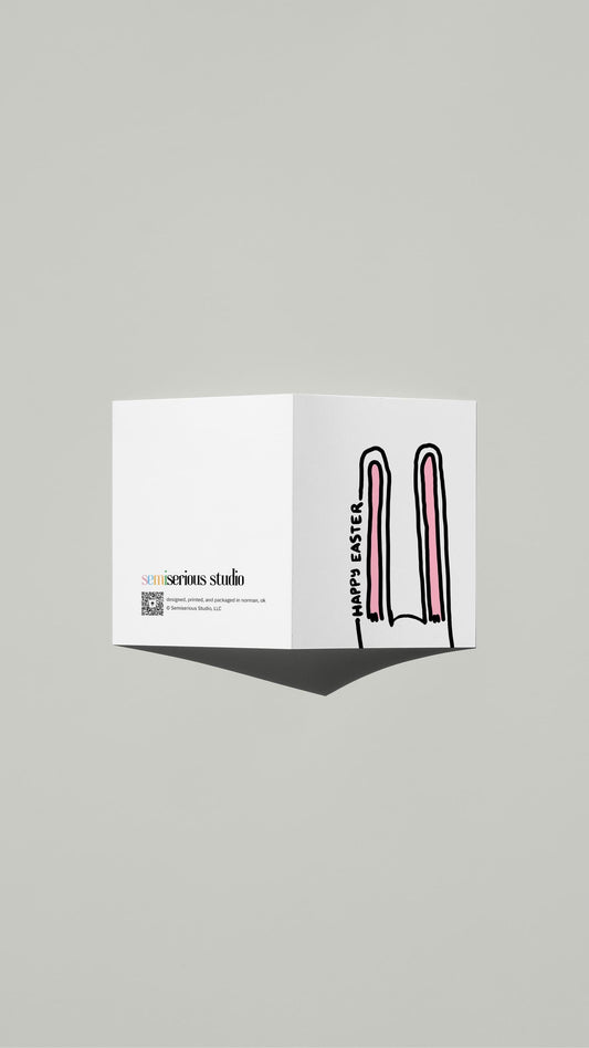 Bunny Ears Easter card standing open, showing the front artwork and the Semiserious Studio logo on the back