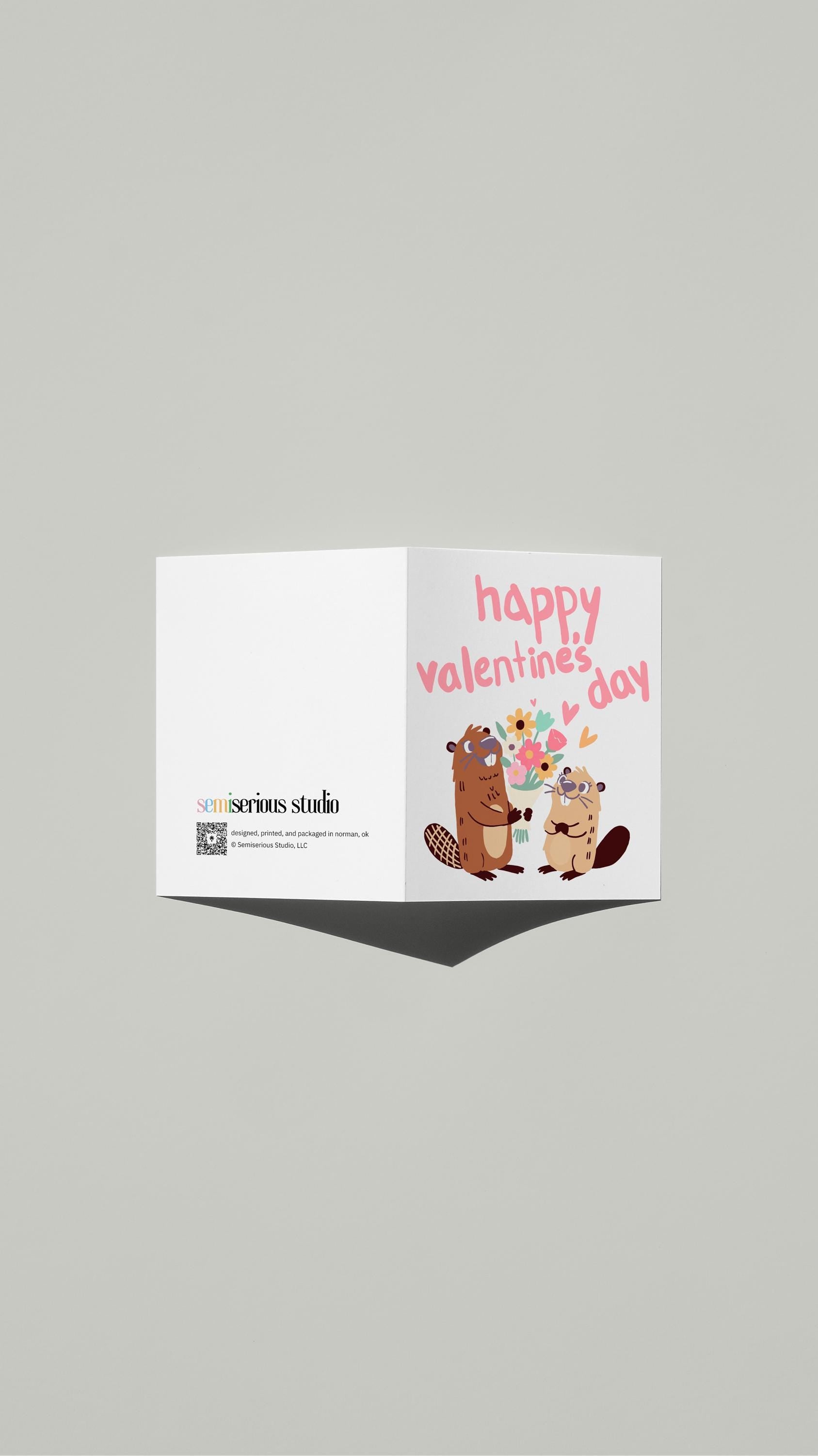 Cartoon Beavers Valentine card standing open, showing the front artwork and the Semiserious Studio logo on the back
