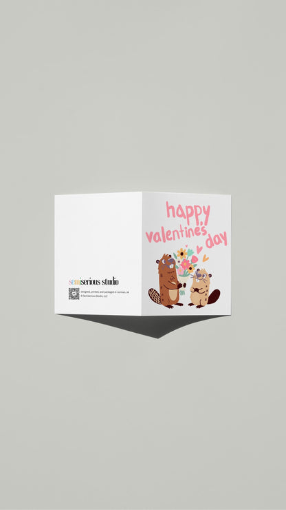 Cartoon Beavers Valentine card standing open, showing the front artwork and the Semiserious Studio logo on the back