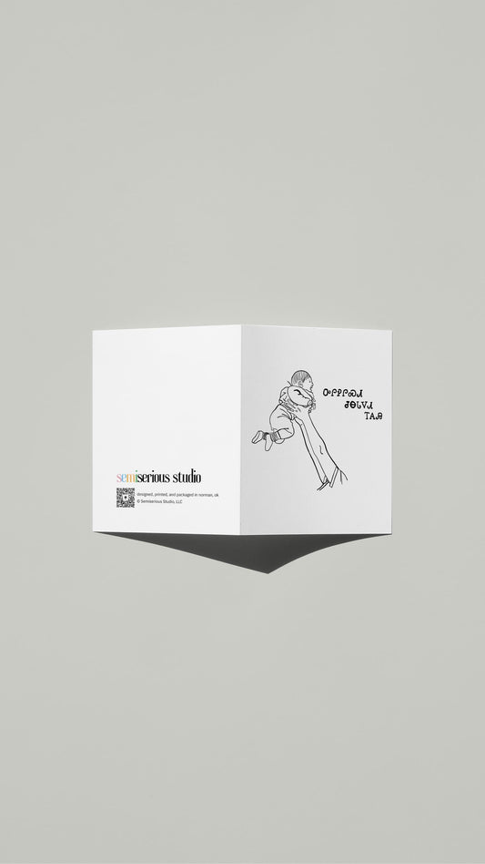 Cherokee Dad Holding Baby Father's Day card standing open, showing the front artwork and the Semiserious Studio logo on the