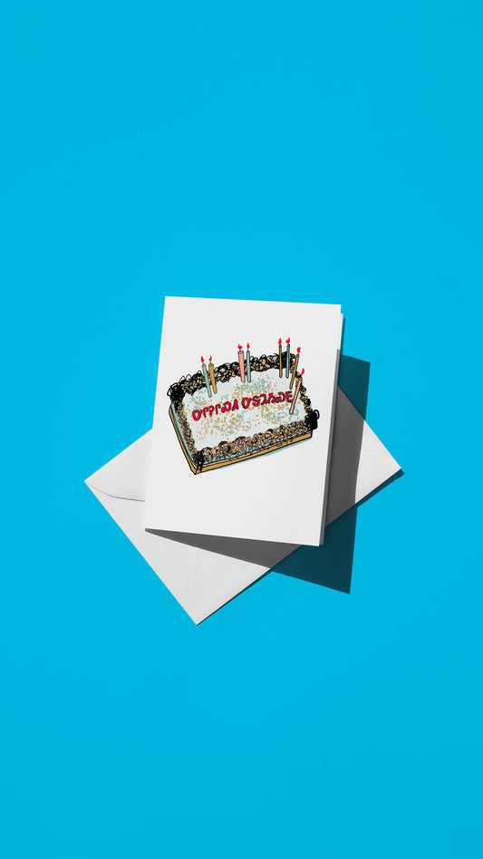 Hand-drawn illustration of a birthday cake with the message "happy birthday" in Cherokee syllabary
