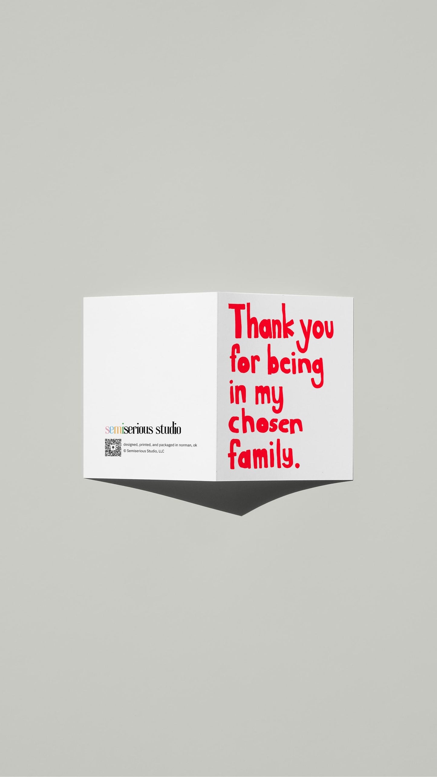 Chosen Family Thank You Pride card standing open, showing the front artwork and the Semiserious Studio logo on the back