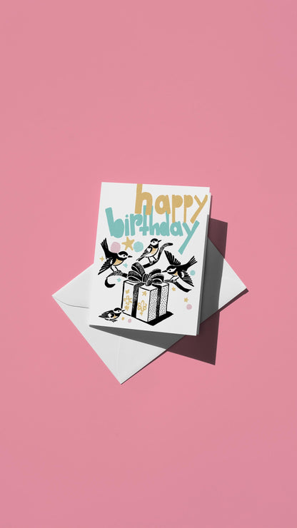 Hand-drawn illustration of four small birds unwrapping a birthday present with the message "happy birthday" in pastel colors