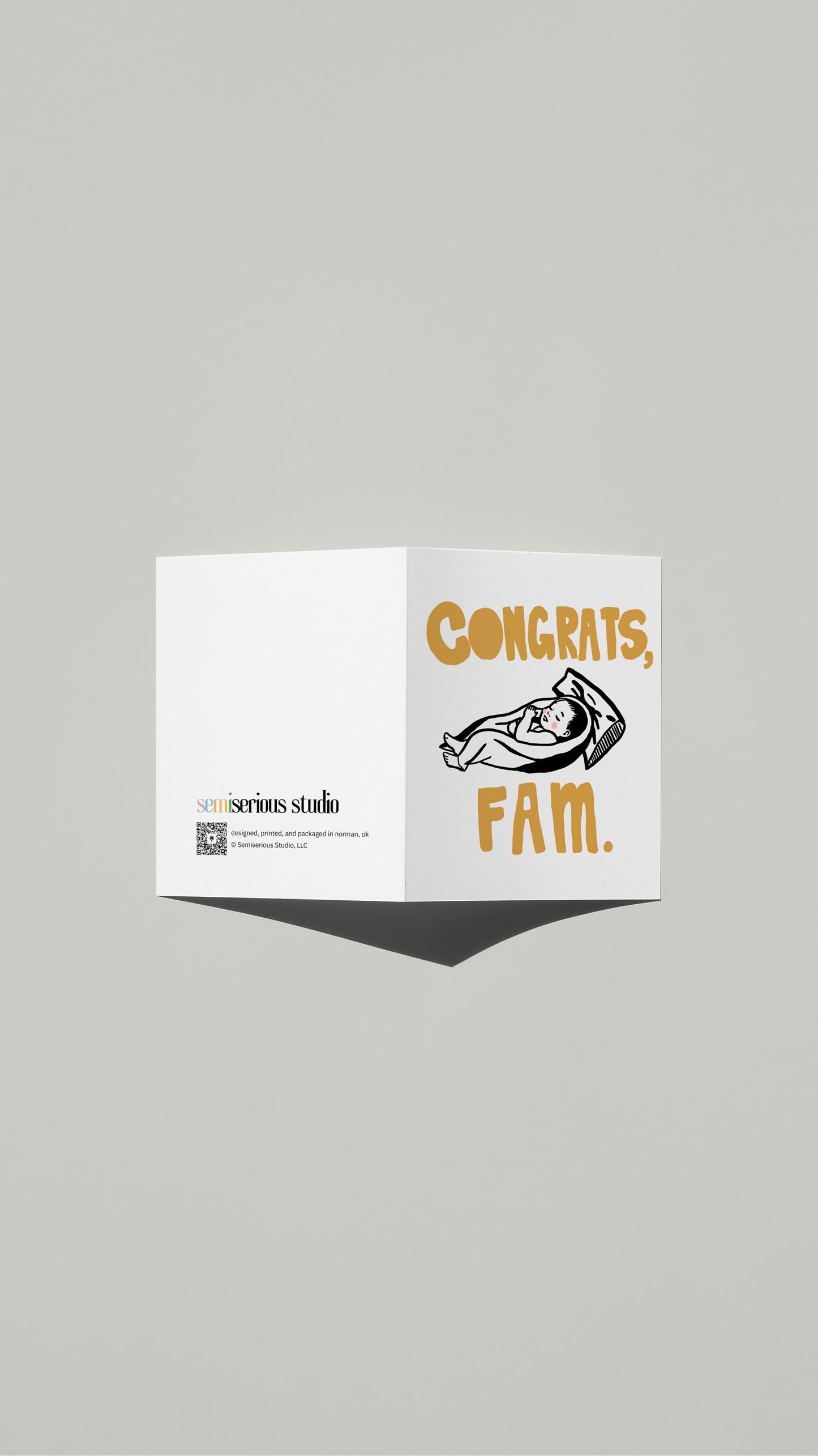 Congrats Fam New Baby card standing open, showing the front artwork and the Semiserious Studio logo on the back