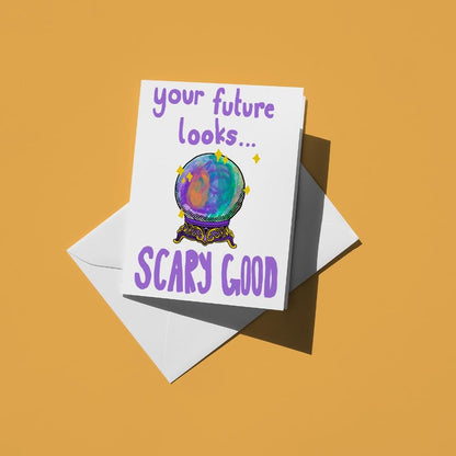 Hand-drawn illustration of a magic crystal ball with the message "your future looks... scary good"