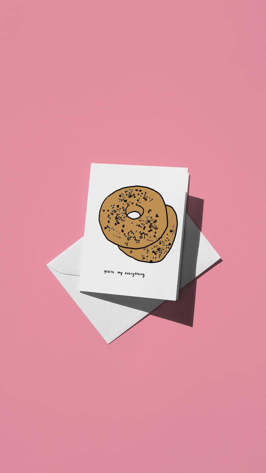 Hand-drawn illustration of an everything bagel with the message "you're my everything"