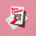Stone fireplace hung with stockings and a red rug, with 