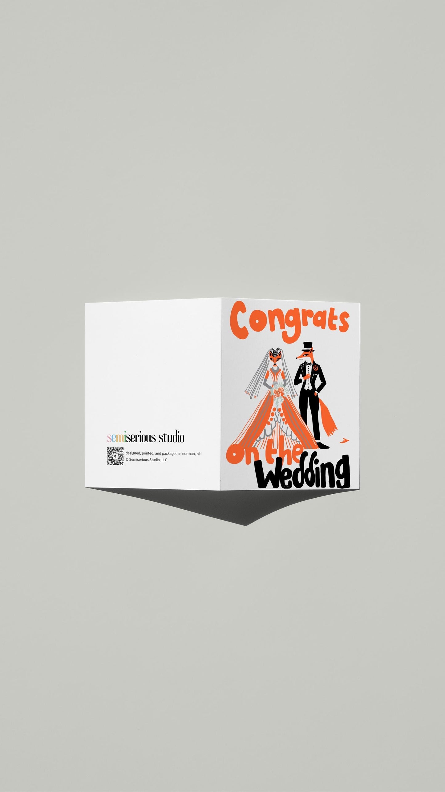 Fox Wedding Congratulations card standing open, showing the front artwork and the Semiserious Studio logo on the back