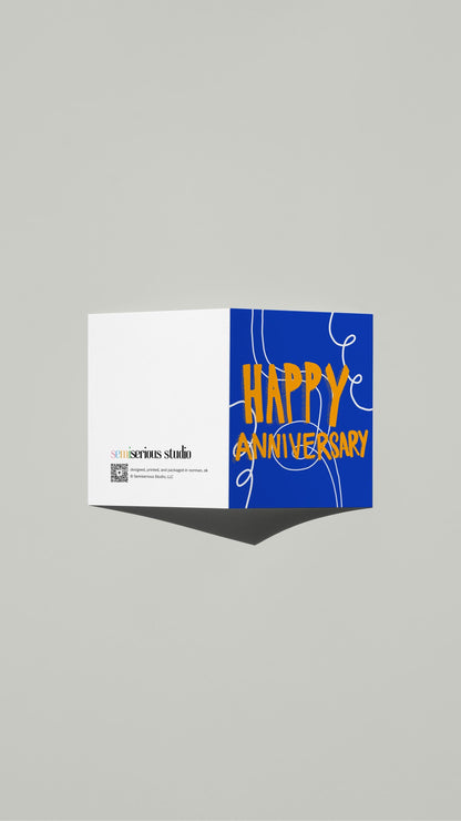 Fun Colorful Anniversary card standing open, showing the front artwork and the Semiserious Studio logo on the back