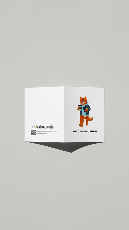 Gemini Tabby Cat Texting Birthday card standing open, showing the front artwork and the Semiserious Studio logo on the back