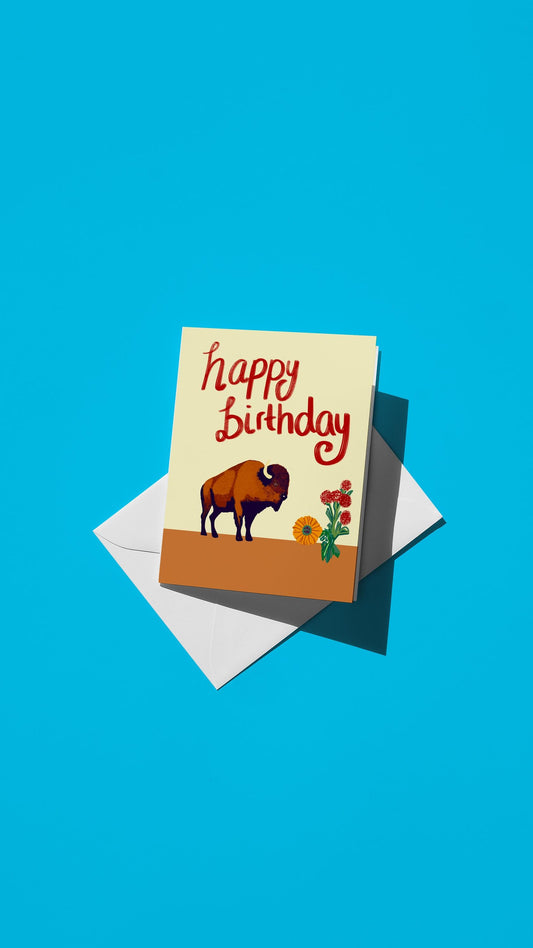 Hand-drawn illustration of a bison and flowers with the message "happy birthday"
