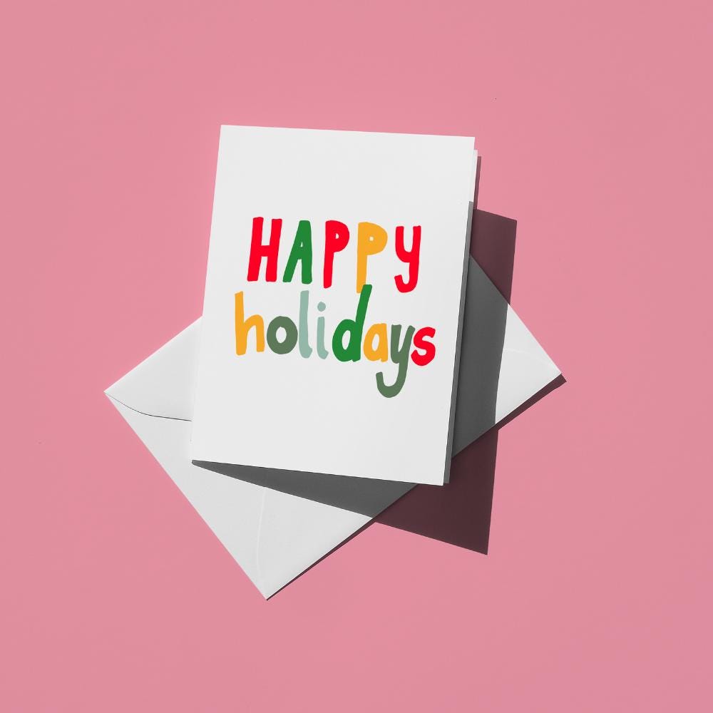 Hand-lettered "Happy holidays" in red, green, blue and yellow