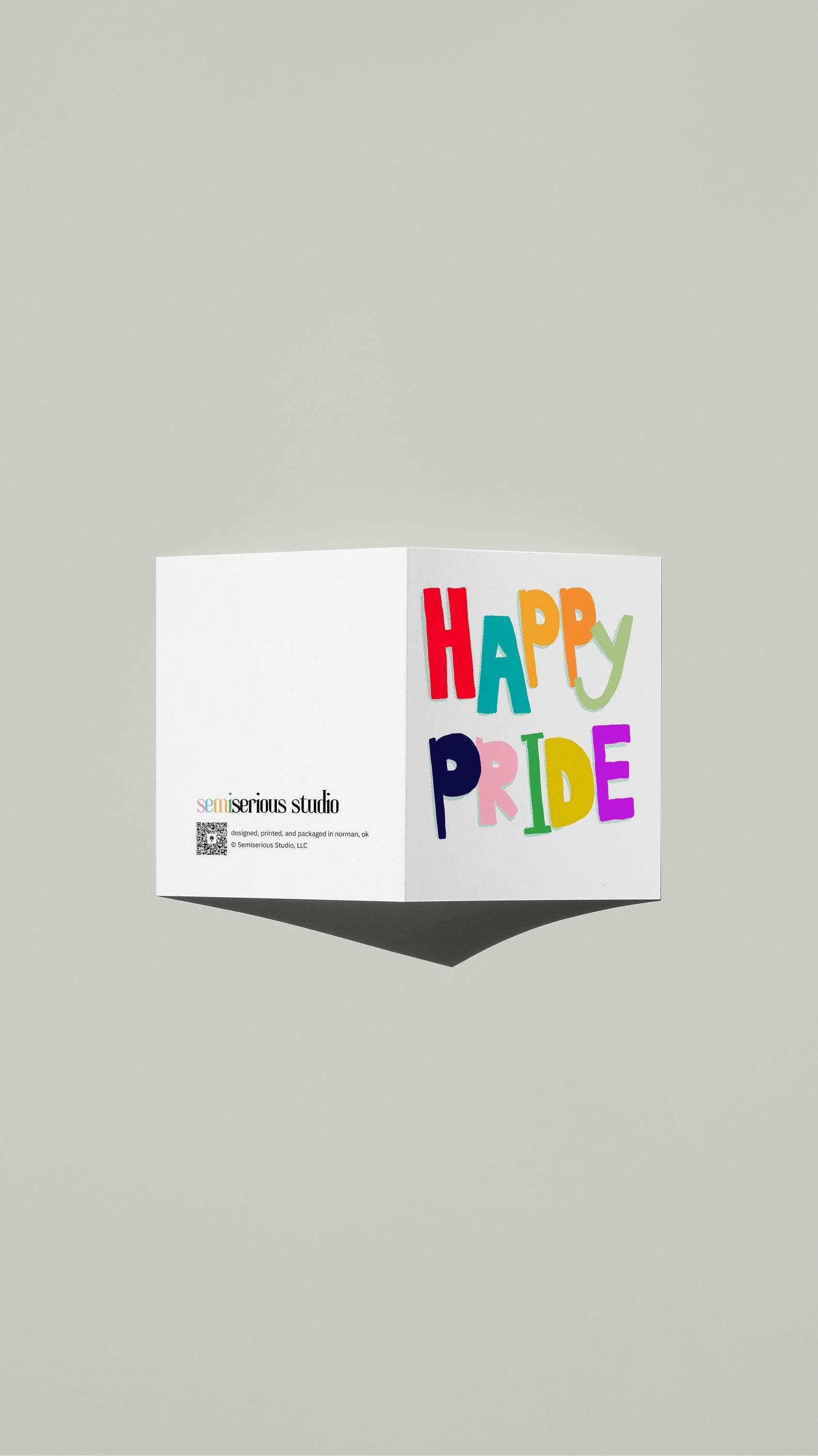 Happy Pride card standing open, showing the front artwork and the Semiserious Studio logo on the back