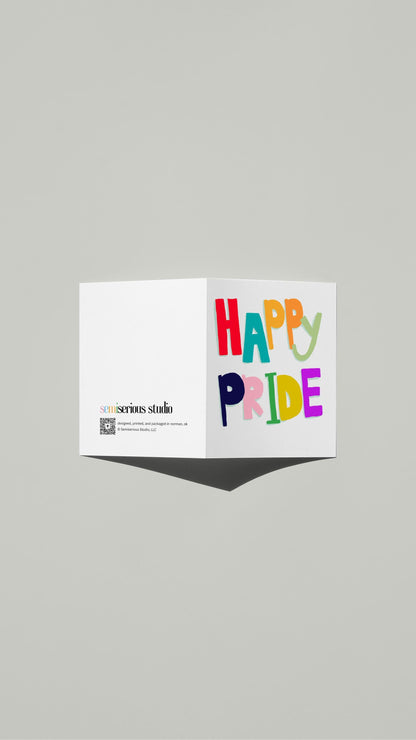 Happy Pride card standing open, showing the front artwork and the Semiserious Studio logo on the back