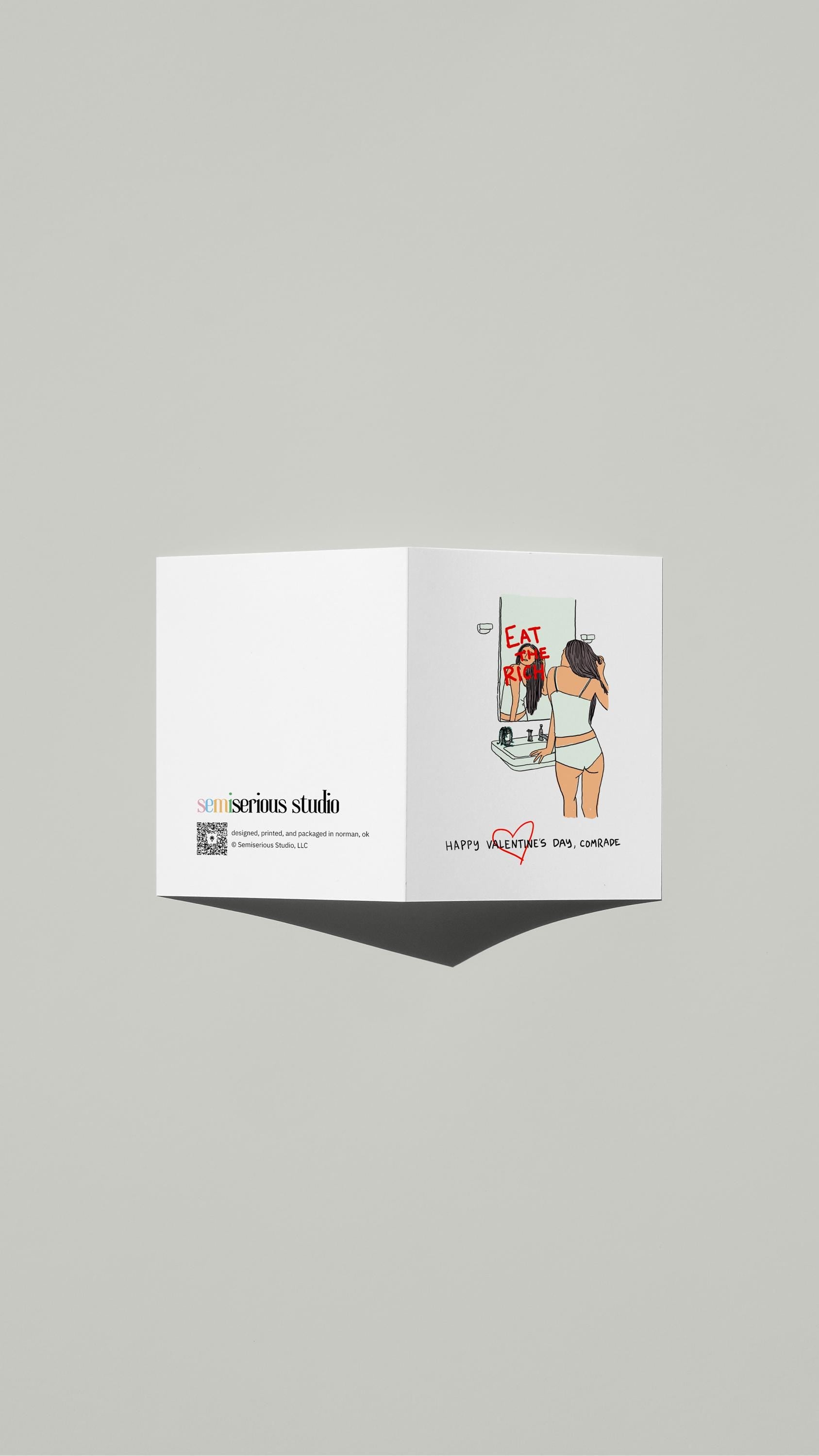 Happy Valentine's Comrade card standing open, showing the front artwork and the Semiserious Studio logo on the back