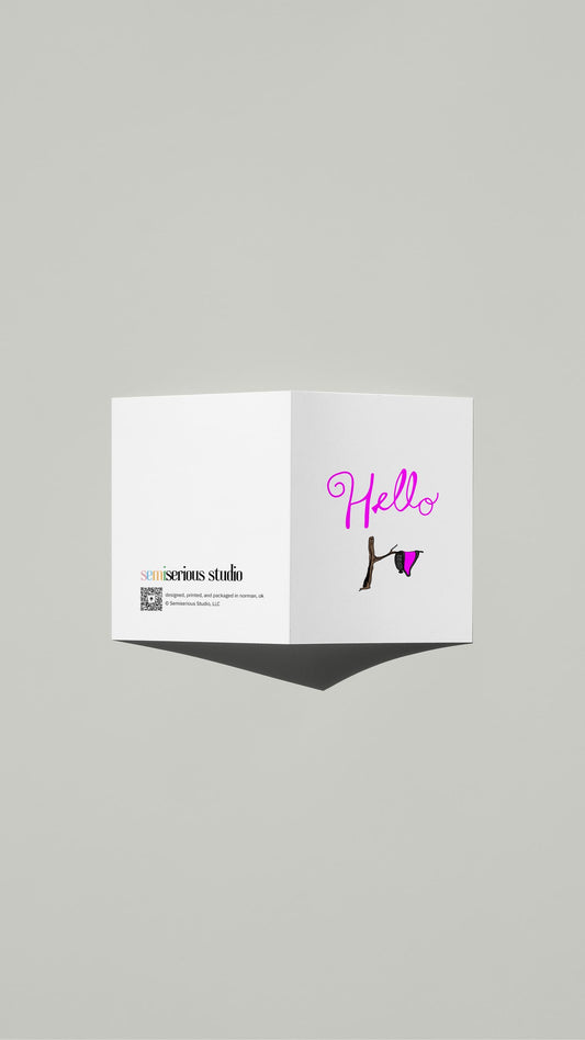 Hello Dali Pun card standing open, showing the front artwork and the Semiserious Studio logo on the back