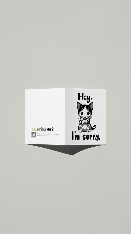 Hey I'm Sorry Kitten Apology card standing open, showing the front artwork and the Semiserious Studio logo on the back
