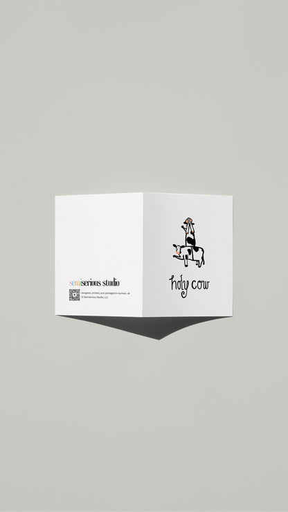 Holy Cow Pope card standing open, showing the front artwork and the Semiserious Studio logo on the back