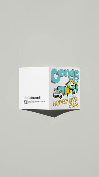 Homeowner Era Congratulations card standing open, showing the front artwork and the Semiserious Studio logo on the back