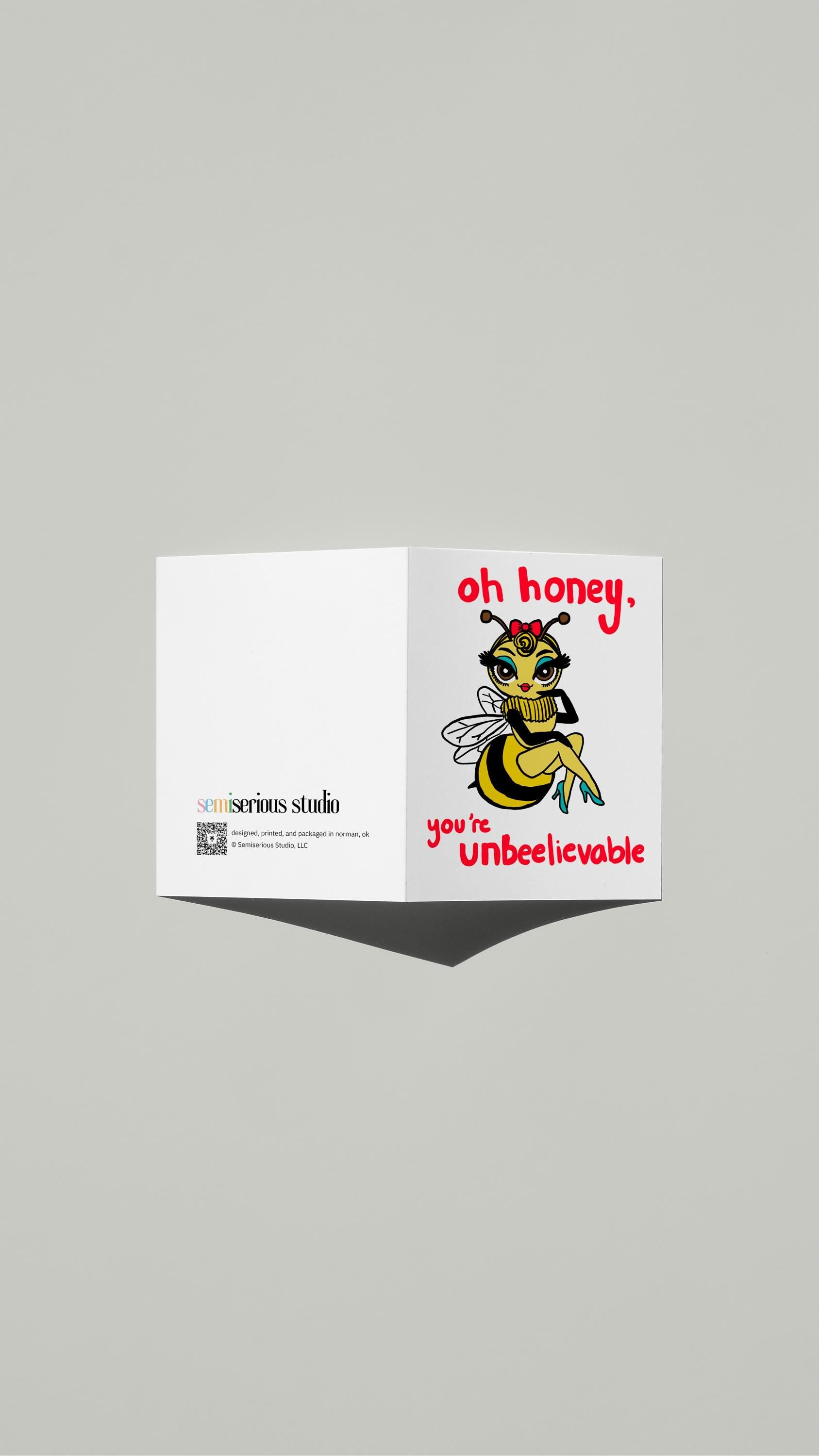 Honeybee Un-bee-lievable card standing open, showing the front artwork and the Semiserious Studio logo on the back
