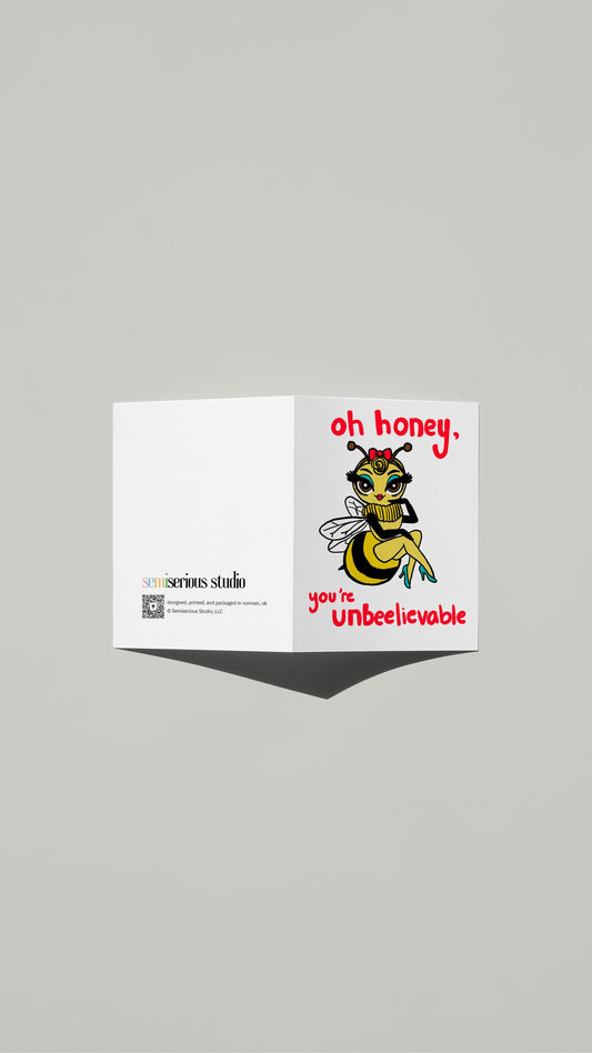 Honeybee Un-bee-lievable card standing open, showing the front artwork and the Semiserious Studio logo on the back