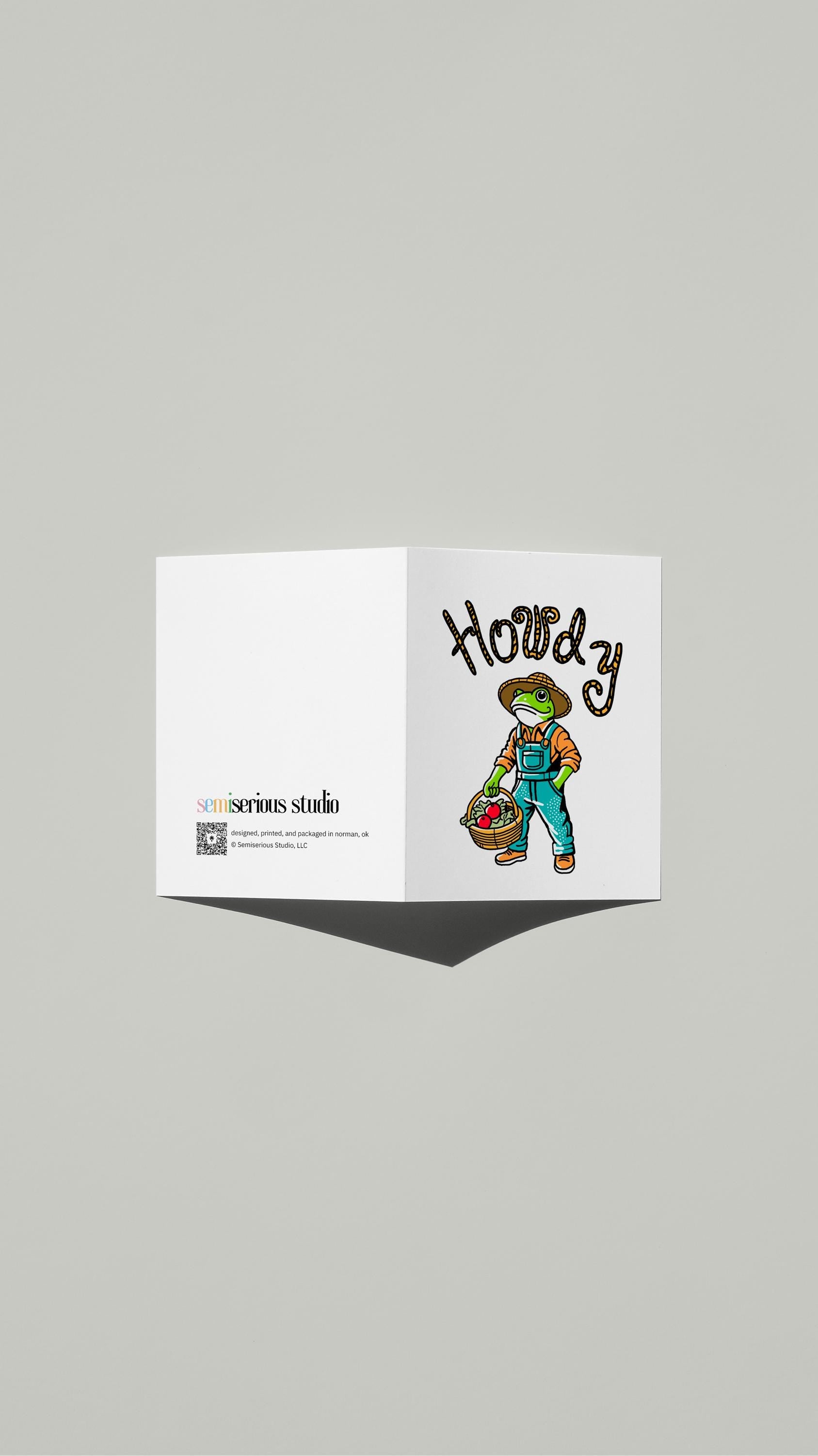 Howdy Frog Gardener card standing open, showing the front artwork and the Semiserious Studio logo on the back