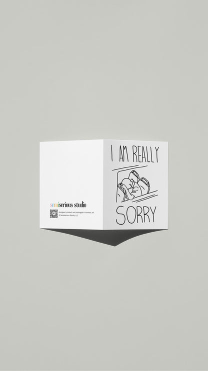 I Am Really Sorry Sympathy card standing open, showing the front artwork and the Semiserious Studio logo on the back