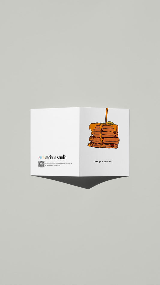 I Like You a Waffle Lot Valentine card standing open, showing the front artwork and the Semiserious Studio logo on the back