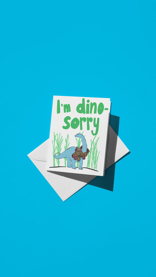 Hand-drawn illustration of a small dinosaur amid tall grass with a message of "I'm dino-sorry"