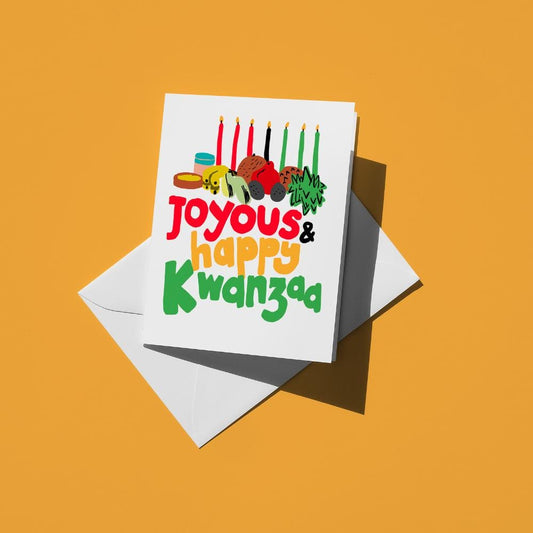 Kinara candles and a feast above multicolour text reading "Joyous and happy Kwanzaa"