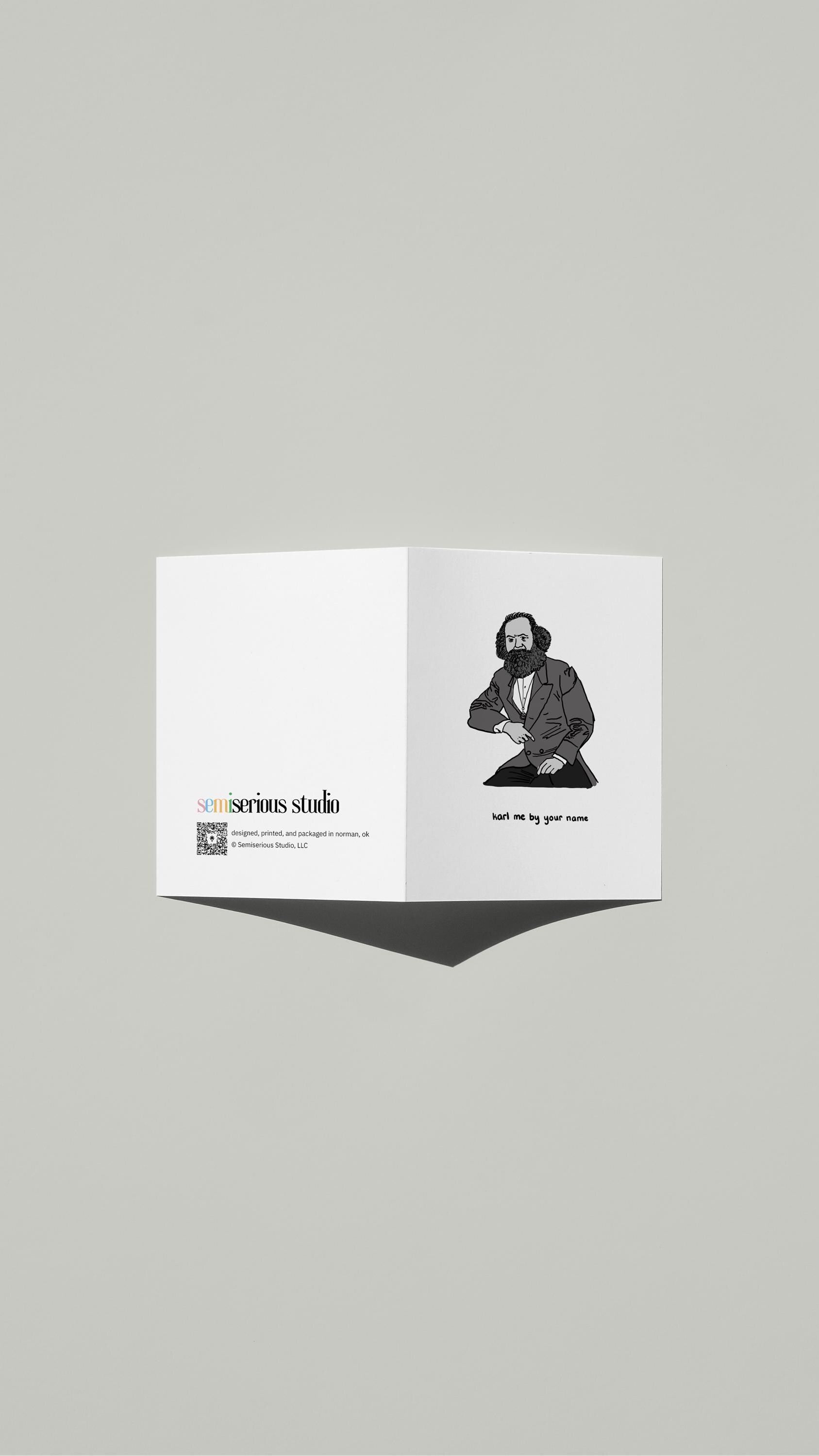 Karl Marx Valentine card standing open, showing the front artwork and the Semiserious Studio logo on the back