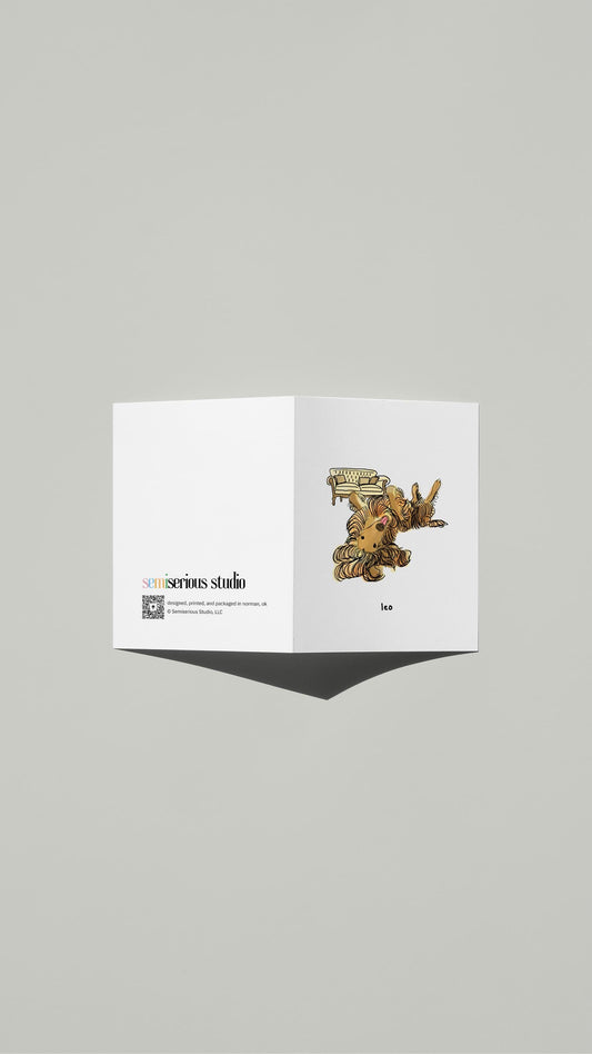 Leo Afghan Hound Birthday card standing open, showing the front artwork and the Semiserious Studio logo on the back
