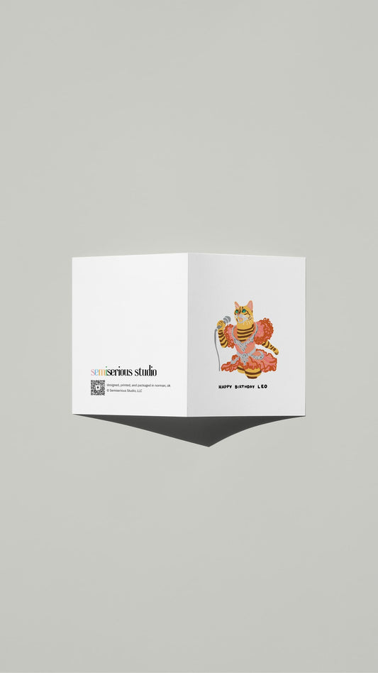 Leo Bengal Cat Karaoke Birthday card standing open, showing the front artwork and the Semiserious Studio logo on the back