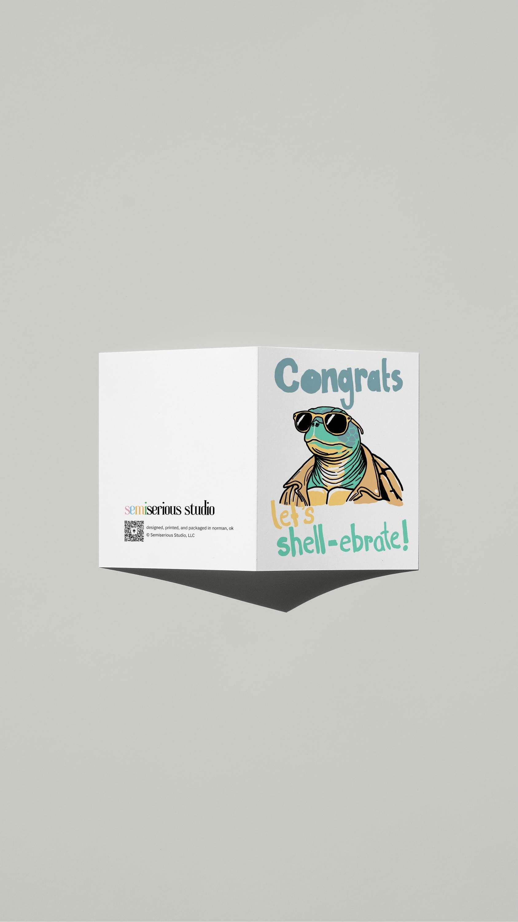 Let's Shell-ebrate Congratulations card standing open, showing the front artwork and the Semiserious Studio logo on the back