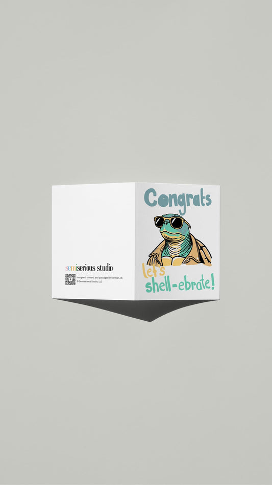 Let's Shell-ebrate Congratulations card standing open, showing the front artwork and the Semiserious Studio logo on the back