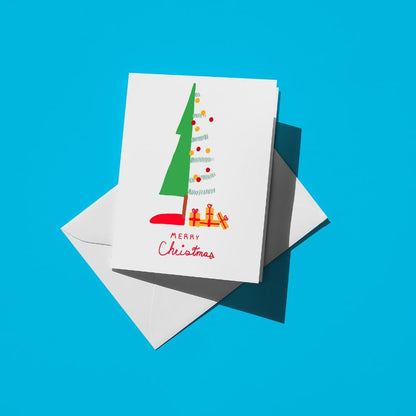 Green Christmas tree with colourful ornaments and gifts, with "Merry Christmas" in red script