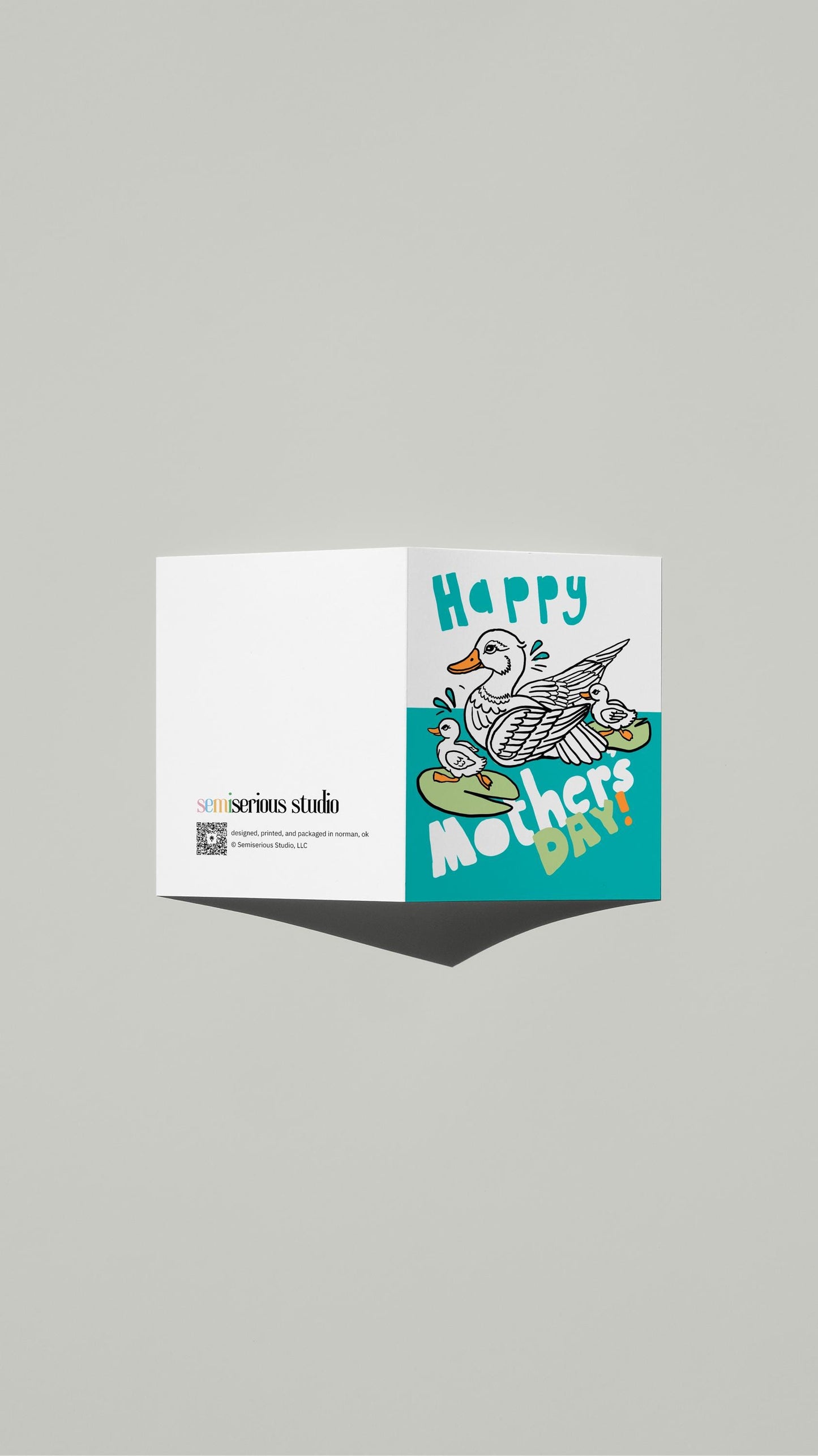 Mother Duck & Ducklings Mother's Day card standing open, showing the front artwork and the Semiserious Studio logo on the