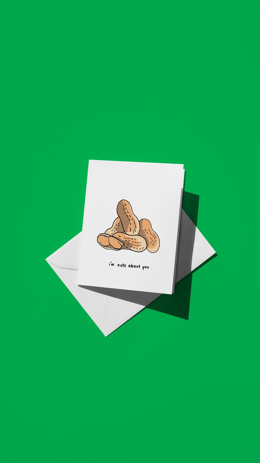 Hand-drawn illustration of peanuts with the message "i'm nuts about you"